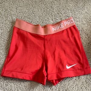Red/ orange Nike pros